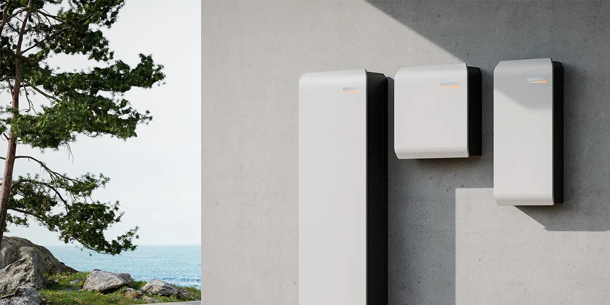 Generac PWRcell 2 battery cabinet, inverter, and Smart Disconnect Switch mounted on an exterior concrete wall